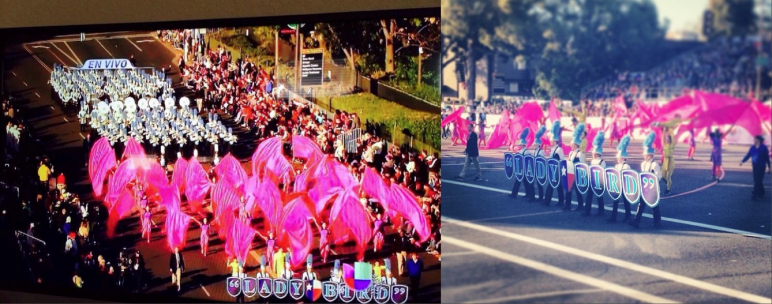 Marching band performing with pink feathered hats and colorful uniforms.