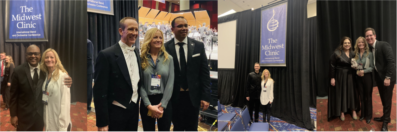 Two professionally dressed individuals smiling at an event.