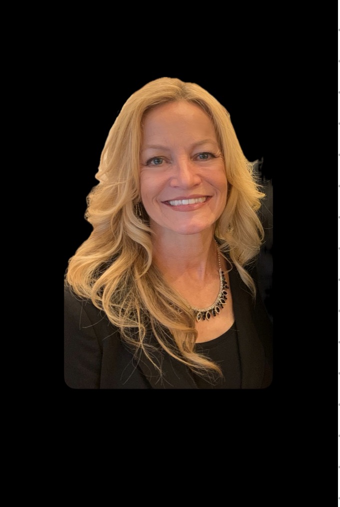 Smiling woman with blonde hair in black attire against a dark background.